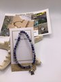 Sodalite gemstone healing bracelet with turtle charm.
