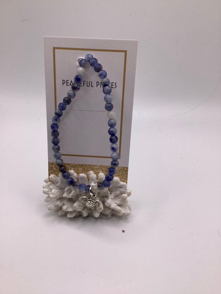Sodalite gemstone healing bracelet with turtle charm.