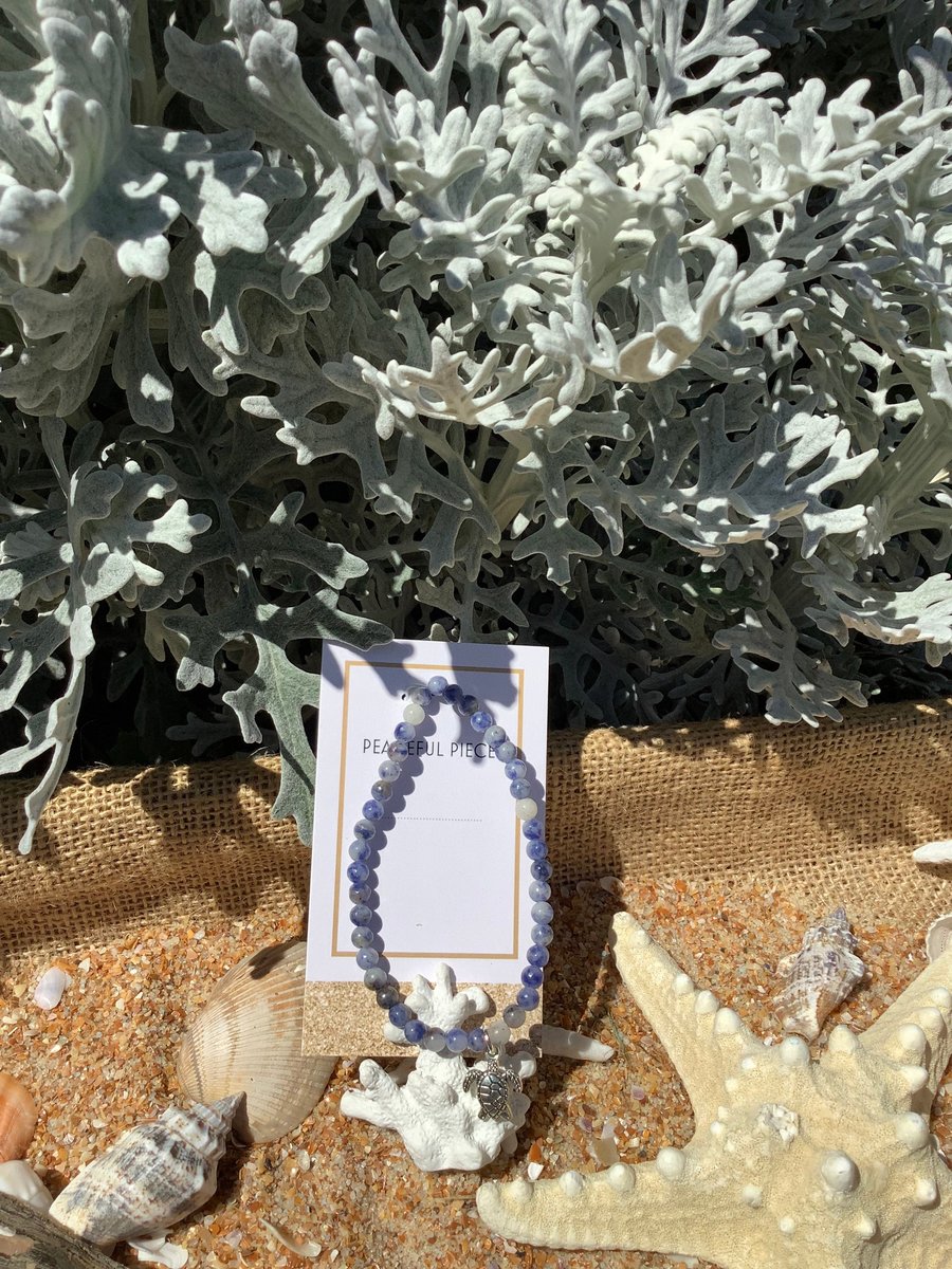 Sodalite gemstone healing bracelet with turtle charm.