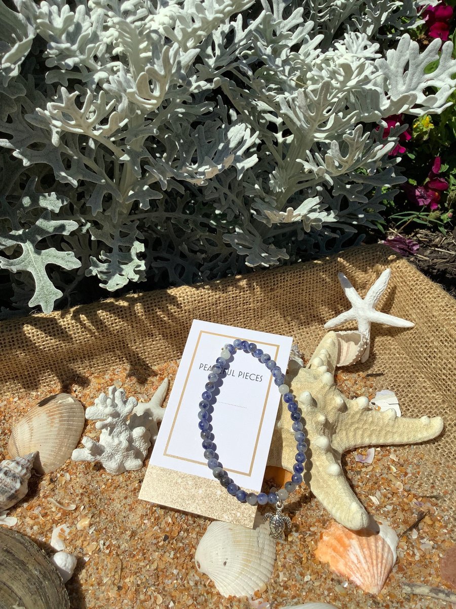 Sodalite gemstone healing bracelet with turtle charm.
