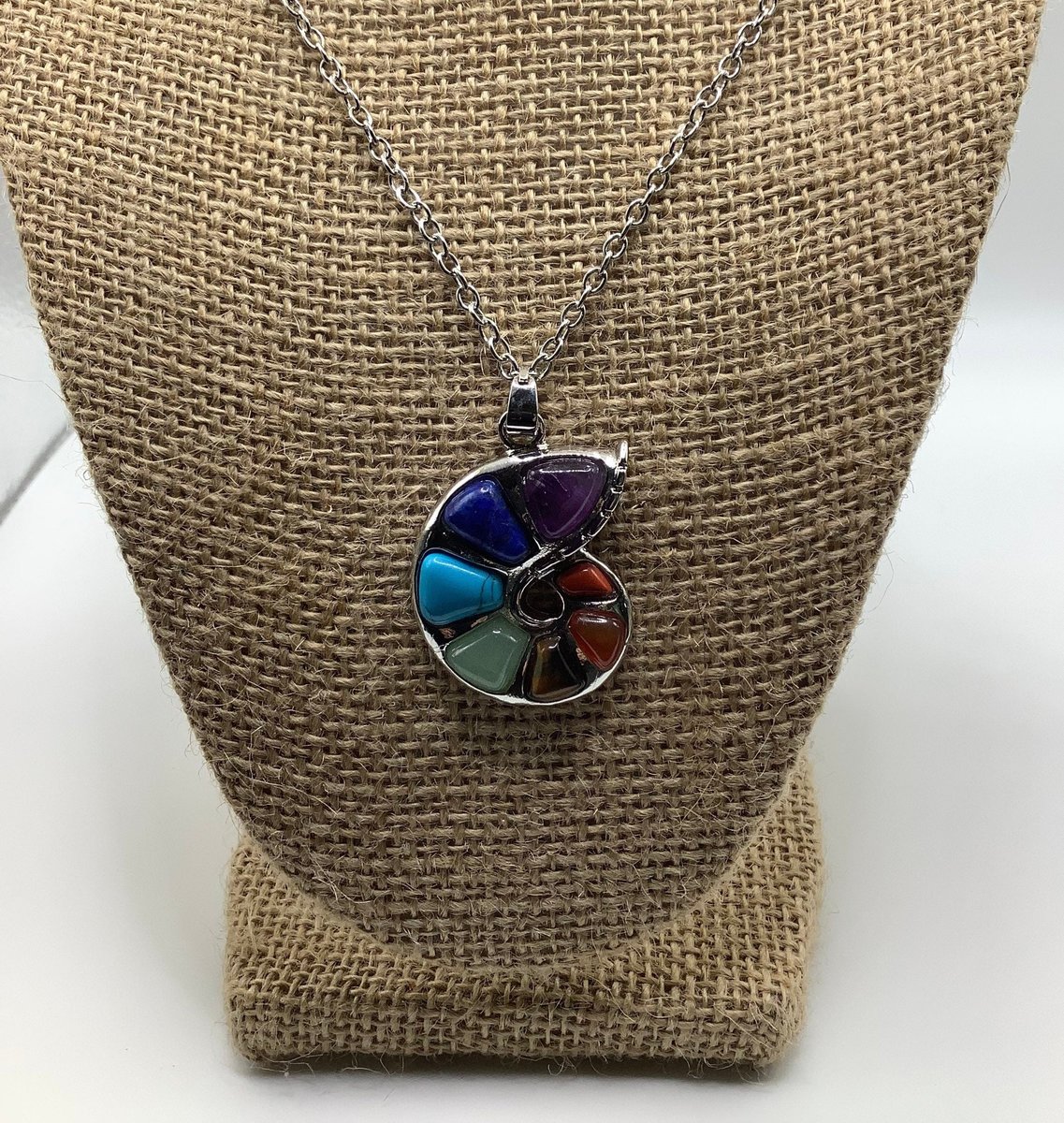 Healing chakra stone nautical shell necklace,pendant, with a 28” silver chain along with a 20-22” adjustable black cord.