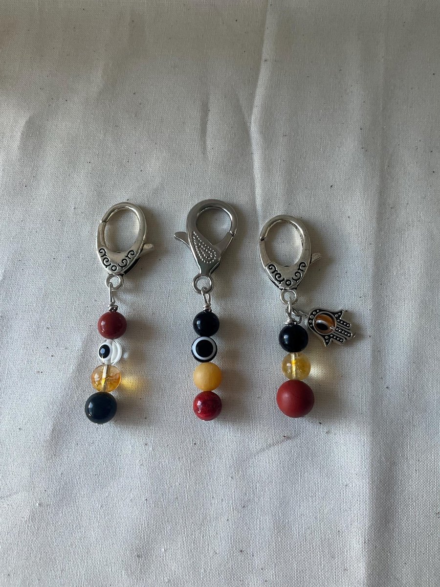 Protection pet gemstone collar charm, purse accessory featuring an evil eye.