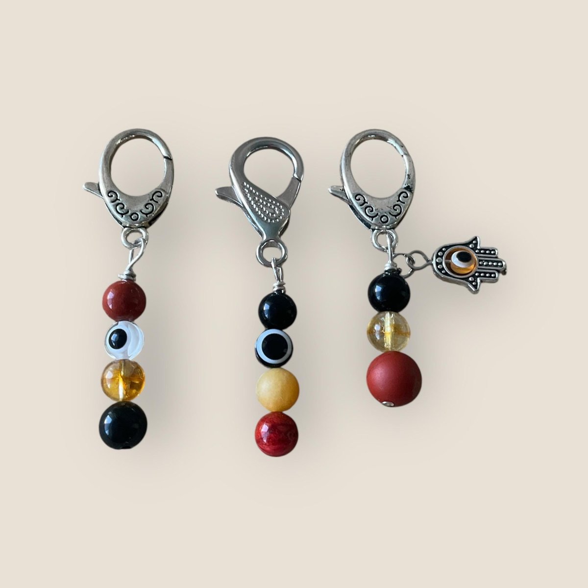 Protection pet gemstone collar charm, purse accessory featuring an evil eye.